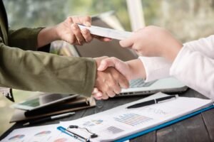 Business people shaking hands, finishing up meeting
